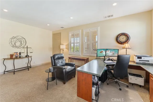 an aerial view of a house with a garden and plants