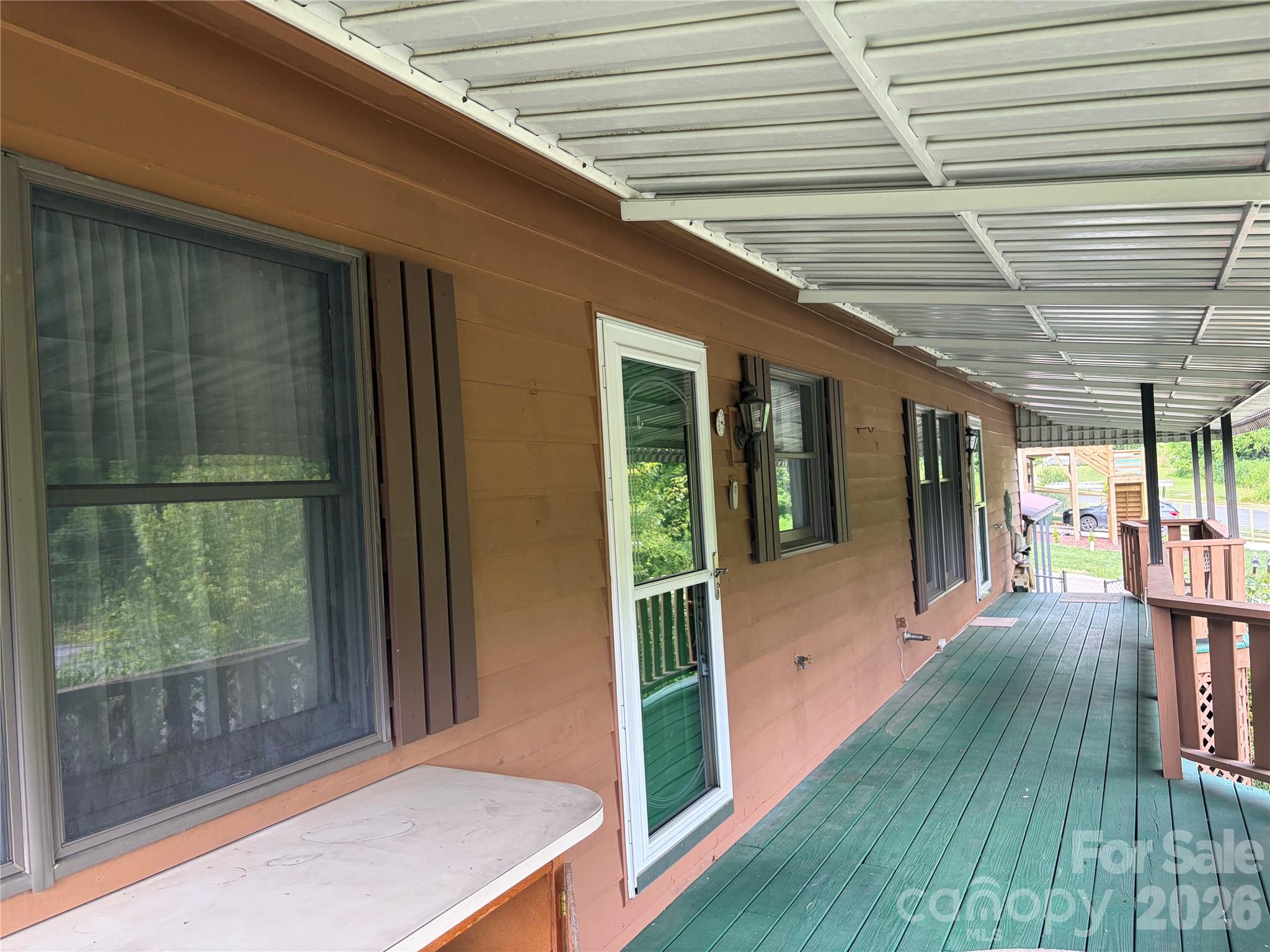 256 A Bruce Road Mars Hill, NC 28754 - Photo 11 of 39 a porch with seating space