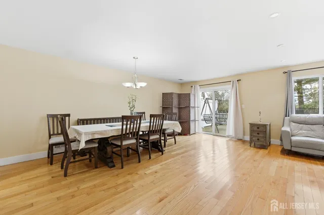 a view of a livingroom with furniture window and wooden floor