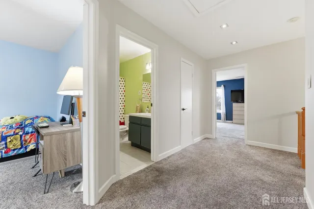 a view of a room with baby toys and dresser