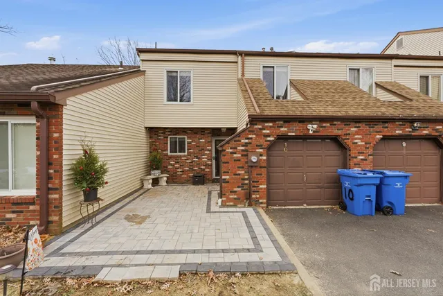 a front view of a house with garage