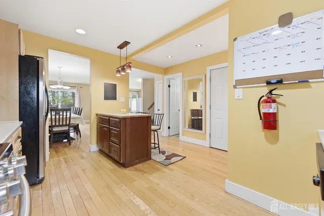 a view of kitchen with furniture and wooden floor