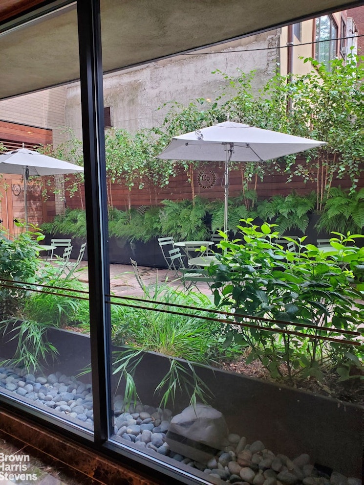 137 East 36th Street, Unit 7K Manhattan, NY 10016 - Photo 14 of 30 a view of a chair and table in the garden