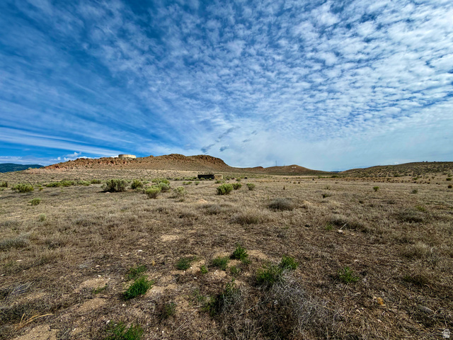 600 East E Street Moroni, UT 84646 - Photo 36 of 38 Expansive land parcel featuring natural desert landscaping and distant mesa formations