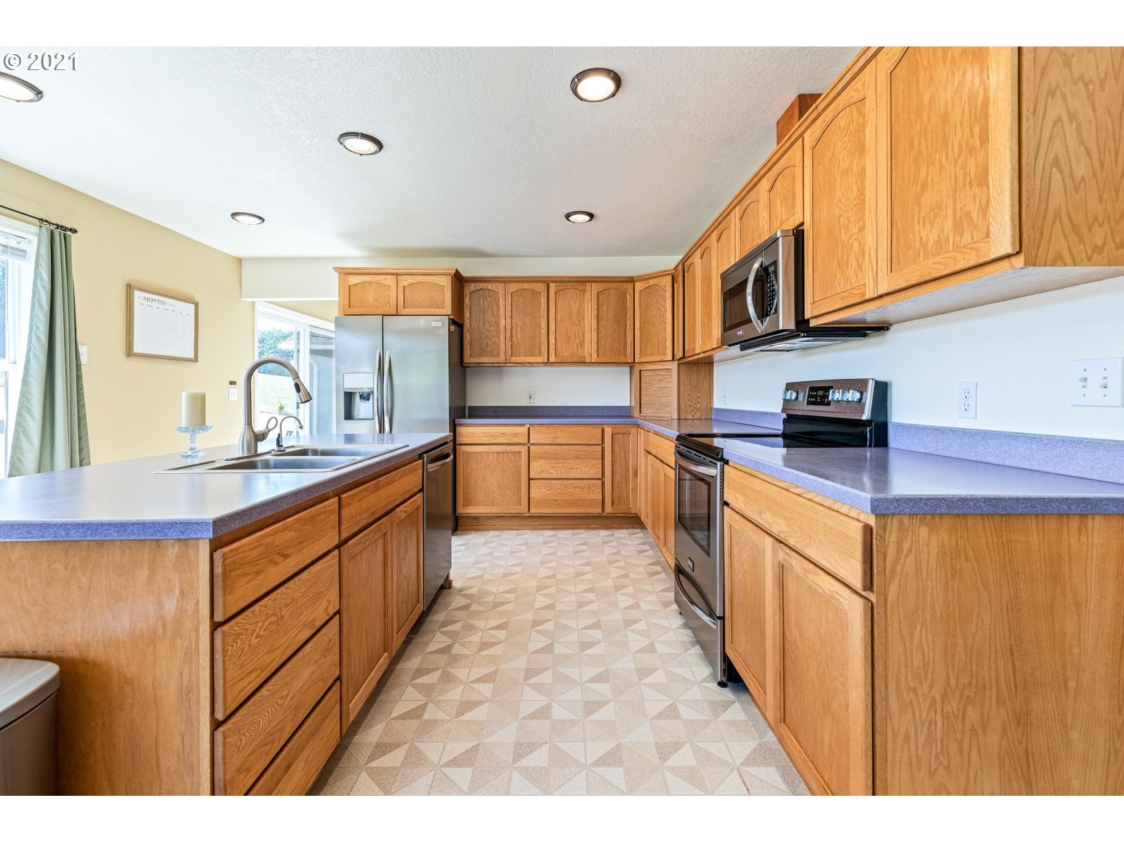 11820 Simpson Road Monmouth, OR 97361 - Photo 4 of 20 a large kitchen with stainless steel appliances granite countertop a sink and cabinets