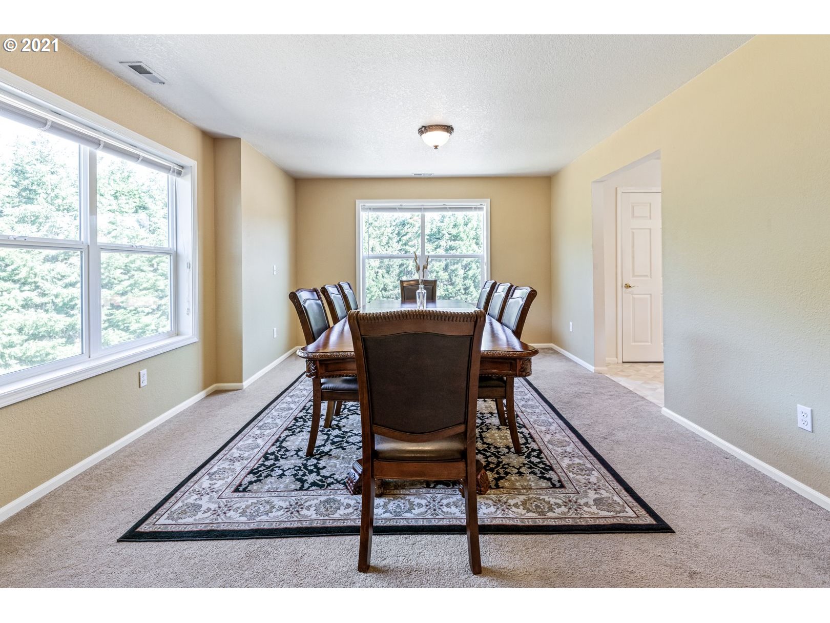 11820 Simpson Road Monmouth, OR 97361 - Photo 7 of 20 a dining room with wooden floor and a floor to ceiling window