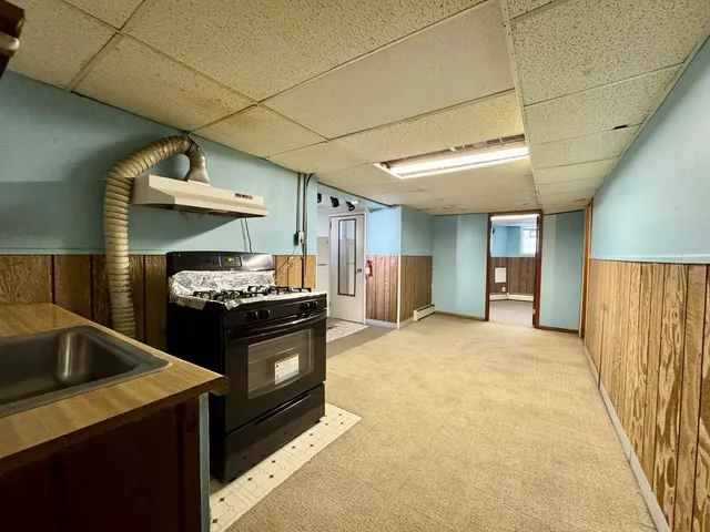 a kitchen with a stove and a refrigerator