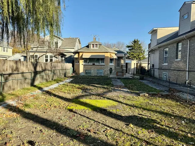 a view of a house with swimming pool and sitting area
