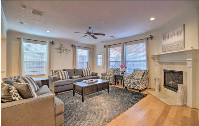 a living room with furniture and a fireplace