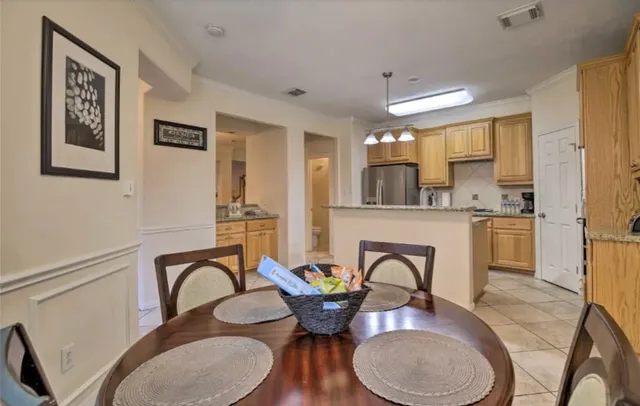 a dining room with furniture window and wooden floor
