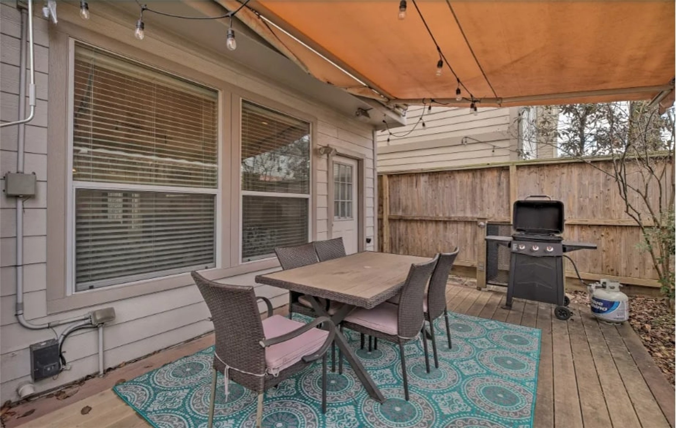 1006 Rochow Street, Unit A Houston, TX 77019 - Photo 14 of 29 a view of a dining table and chairs in the patio