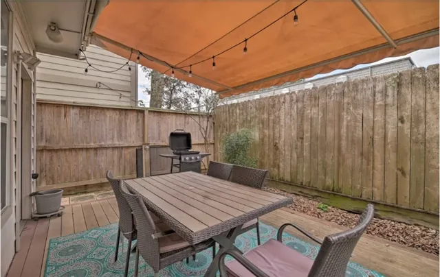 a view of a backyard with furniture