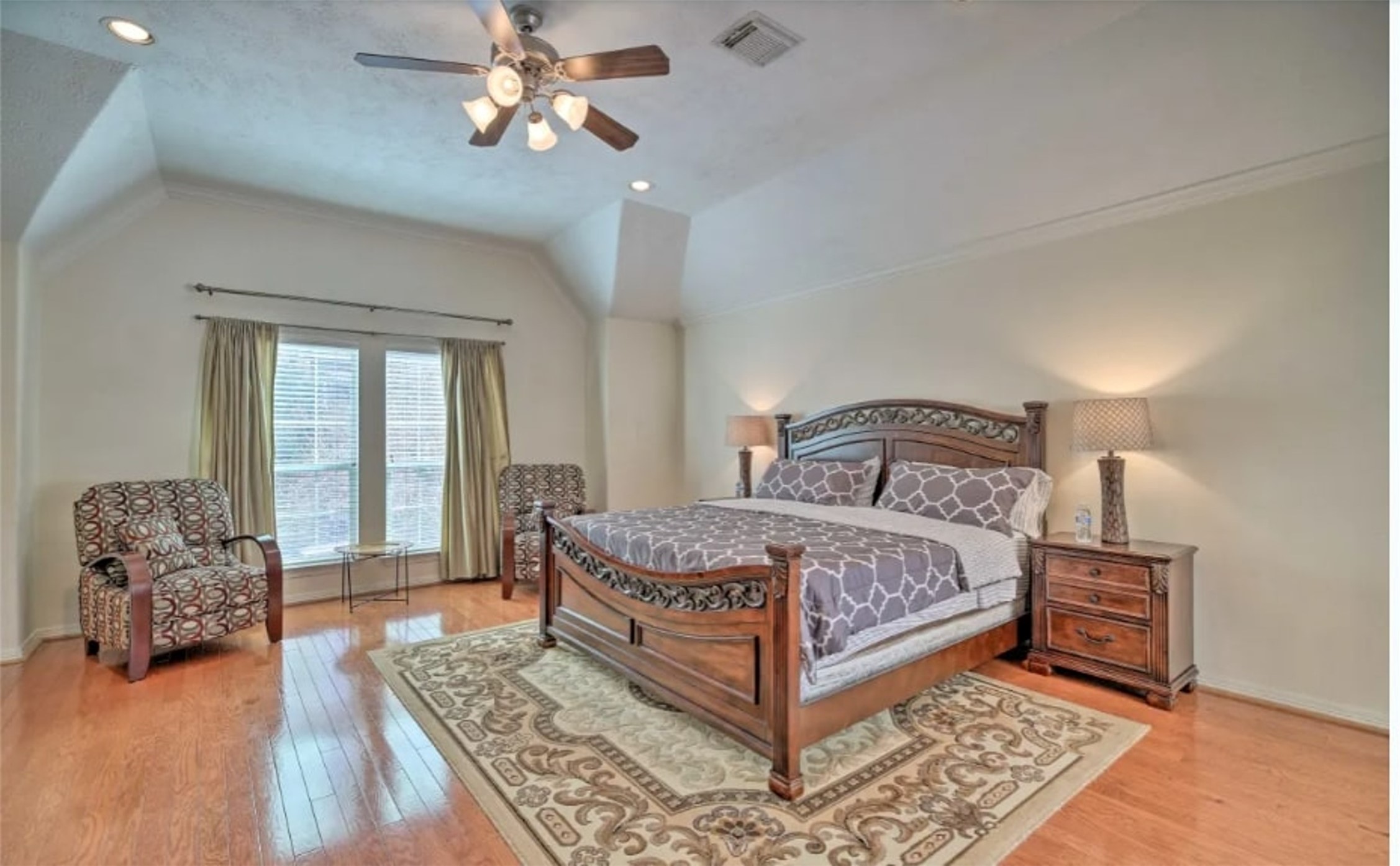 1006 Rochow Street, Unit A Houston, TX 77019 - Photo 16 of 29 a bedroom with a large bed and a chandelier