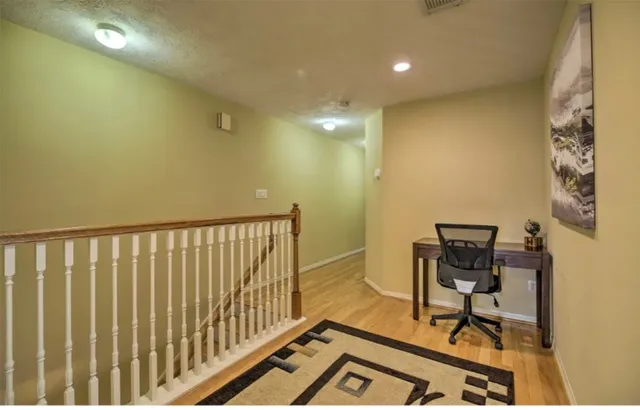 a view of workspace and wooden floor