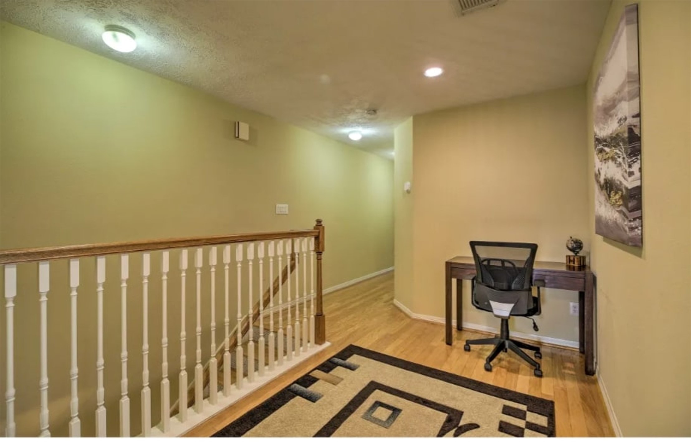 1006 Rochow Street, Unit A Houston, TX 77019 - Photo 18 of 29 a view of workspace and wooden floor