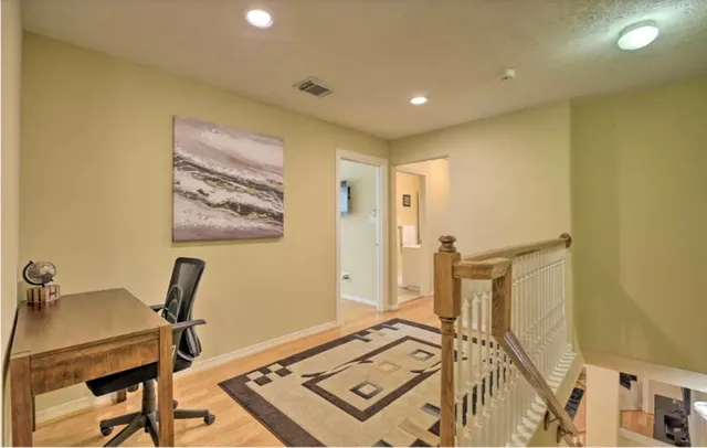 a view of a workspace with furniture