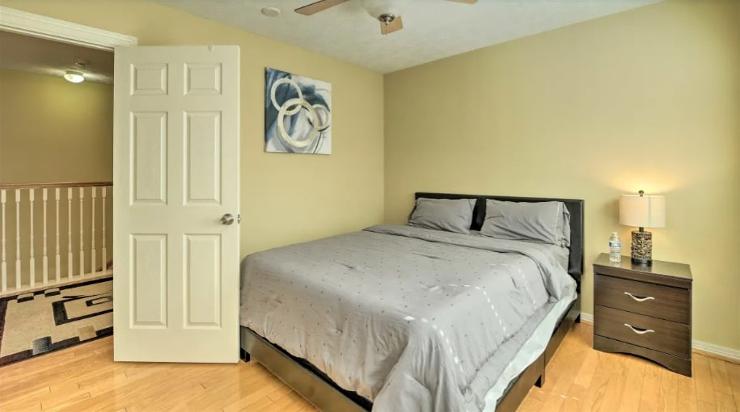 1006 Rochow Street, Unit A Houston, TX 77019 - Photo 20 of 29 a bedroom with a bed and a cabinets