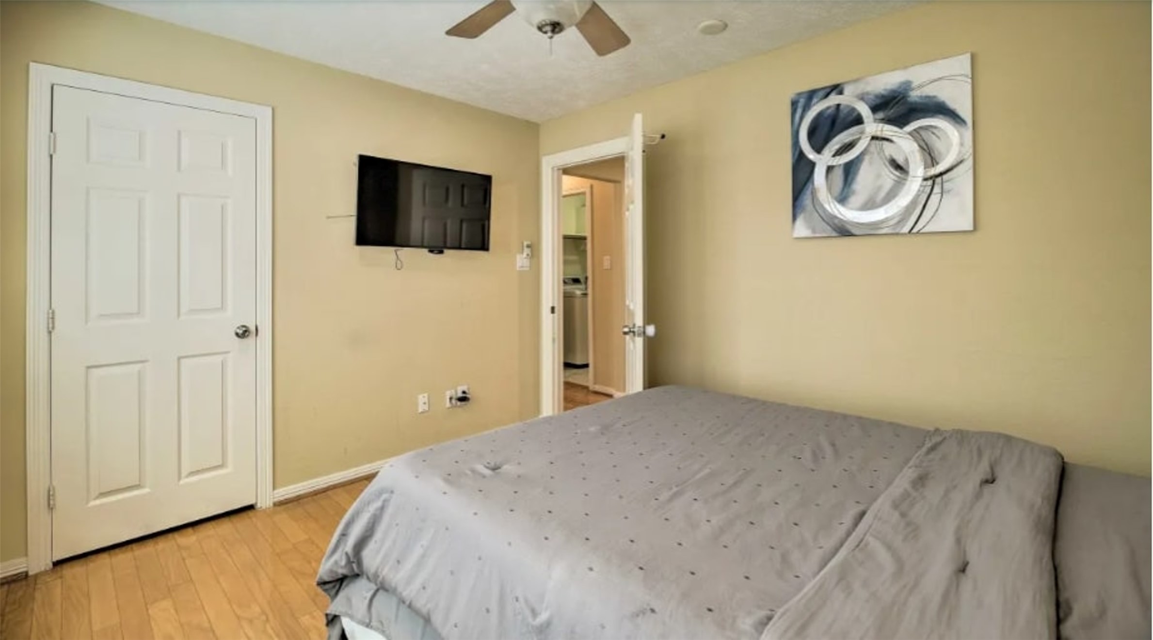 1006 Rochow Street, Unit A Houston, TX 77019 - Photo 21 of 29 a bedroom with a bed and a flat screen tv