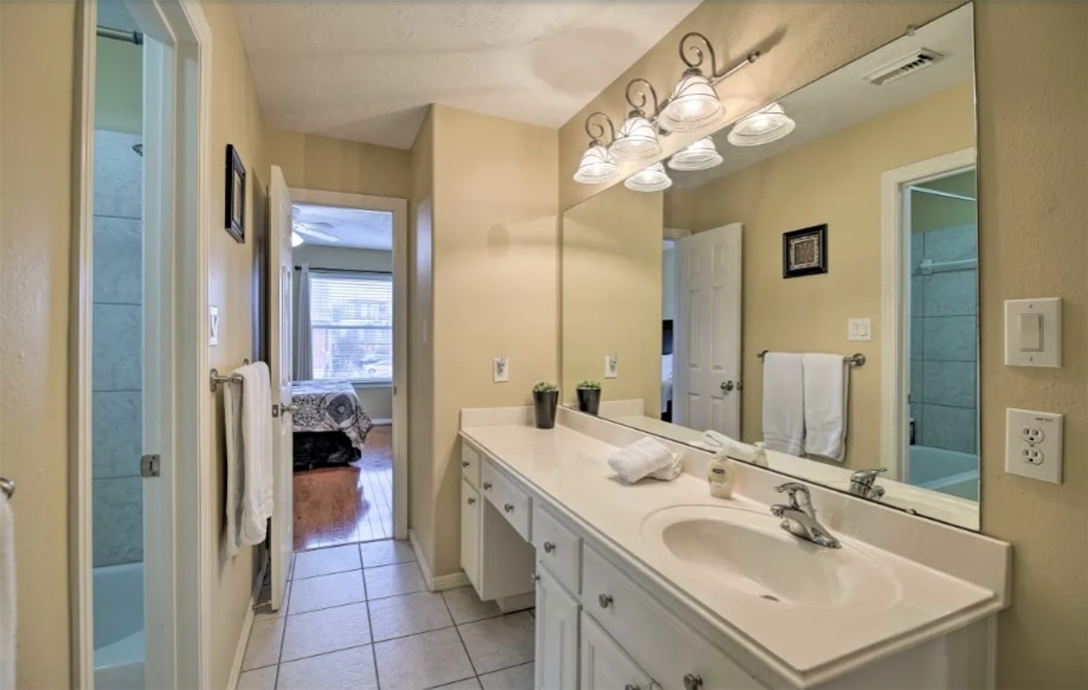 1006 Rochow Street, Unit A Houston, TX 77019 - Photo 22 of 29 a bathroom with a sink vanity and a mirror