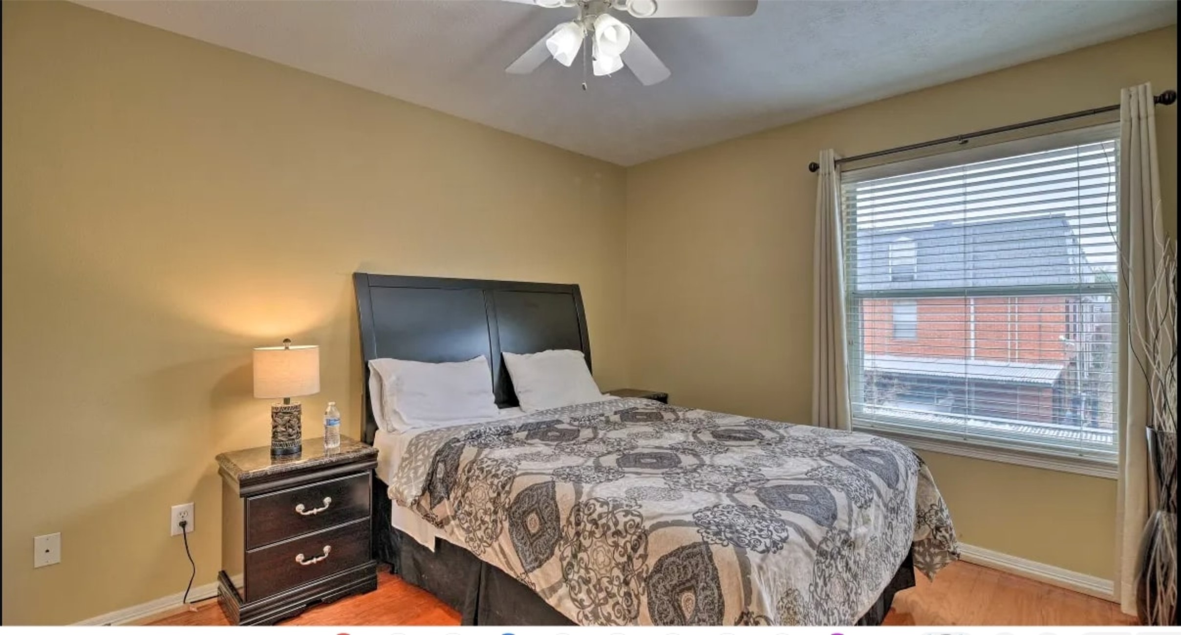 1006 Rochow Street, Unit A Houston, TX 77019 - Photo 25 of 29 a bedroom with a bed and a lamp on dresser
