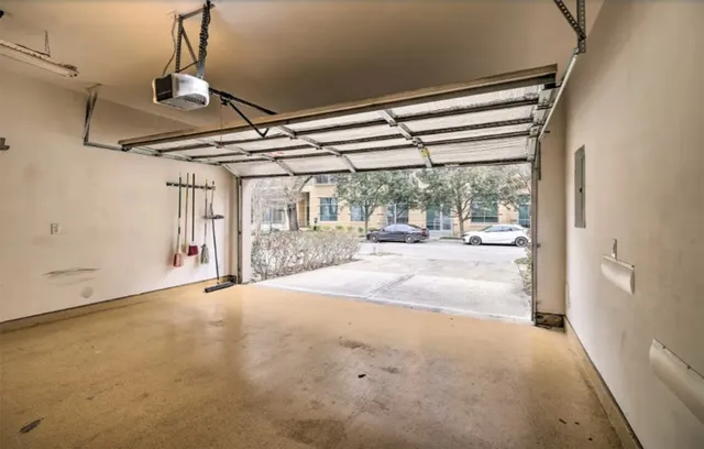 a view of a room with wooden floor and windows