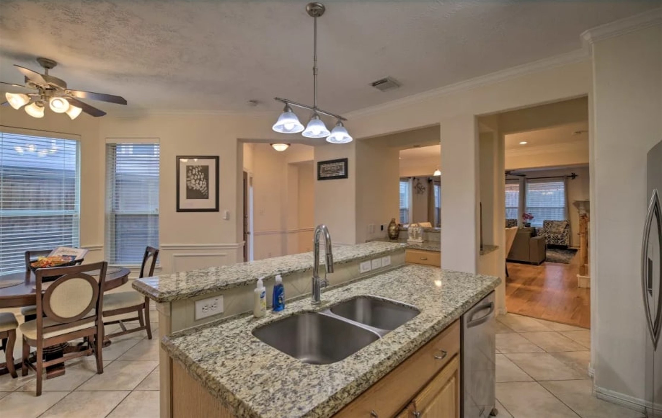 1006 Rochow Street, Unit A Houston, TX 77019 - Photo 7 of 29 a kitchen with granite countertop a sink and chairs