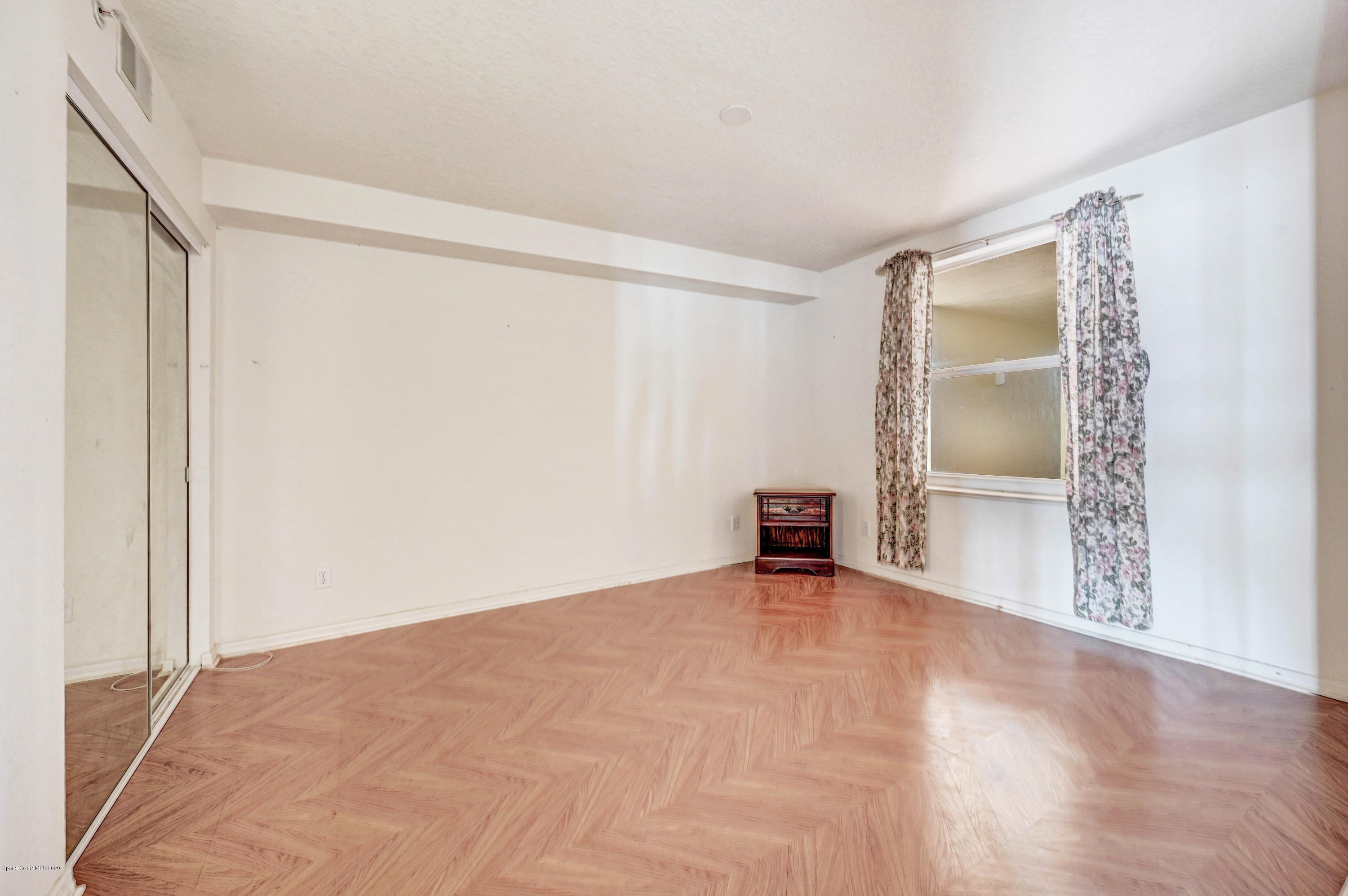 102 Riverside Drive, Unit 304 Cocoa, FL 32922 - Photo 21 of 49 an empty room with closet and a bathroom