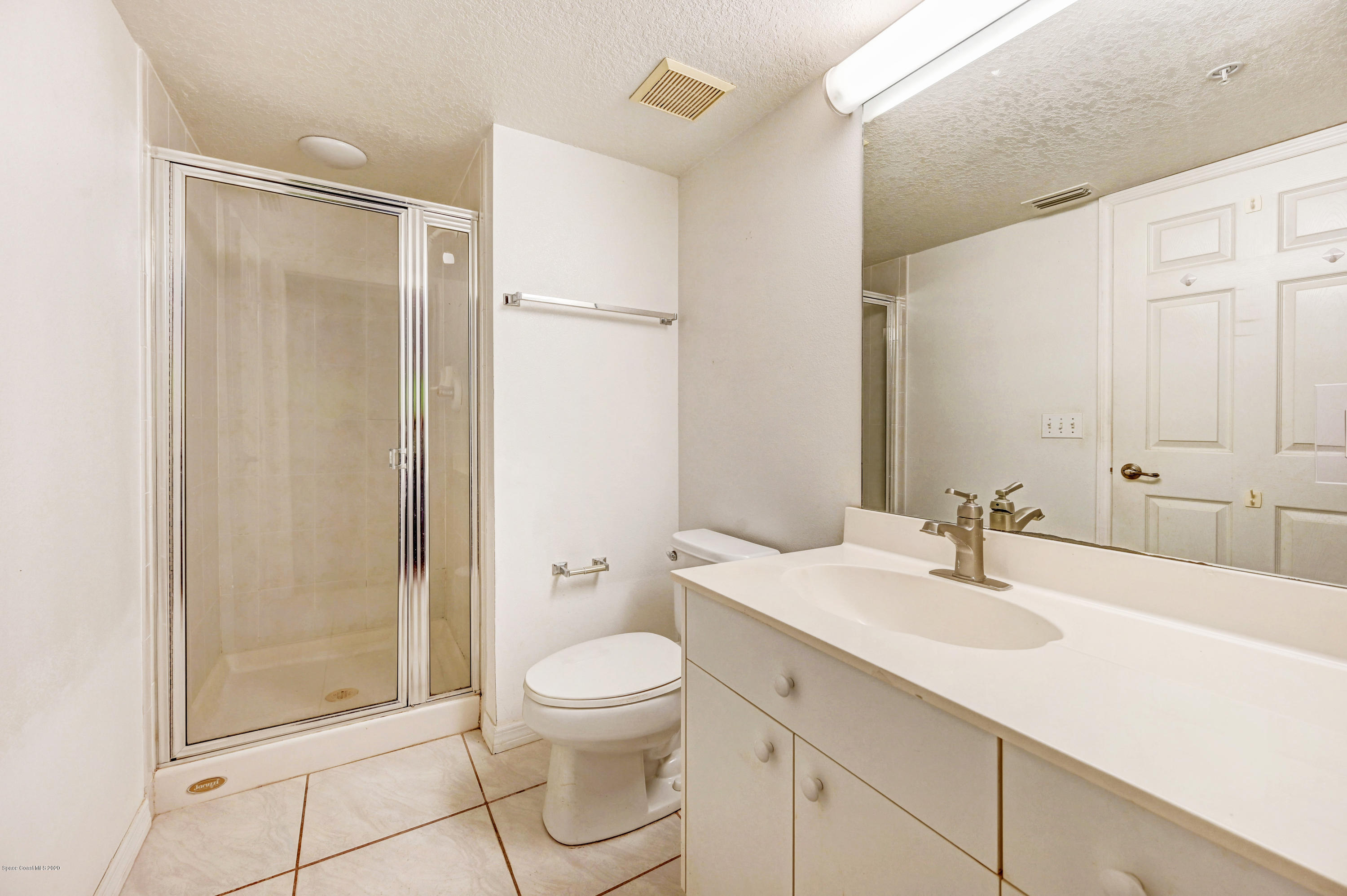 102 Riverside Drive, Unit 304 Cocoa, FL 32922 - Photo 22 of 49 a bathroom with a sink toilet and shower
