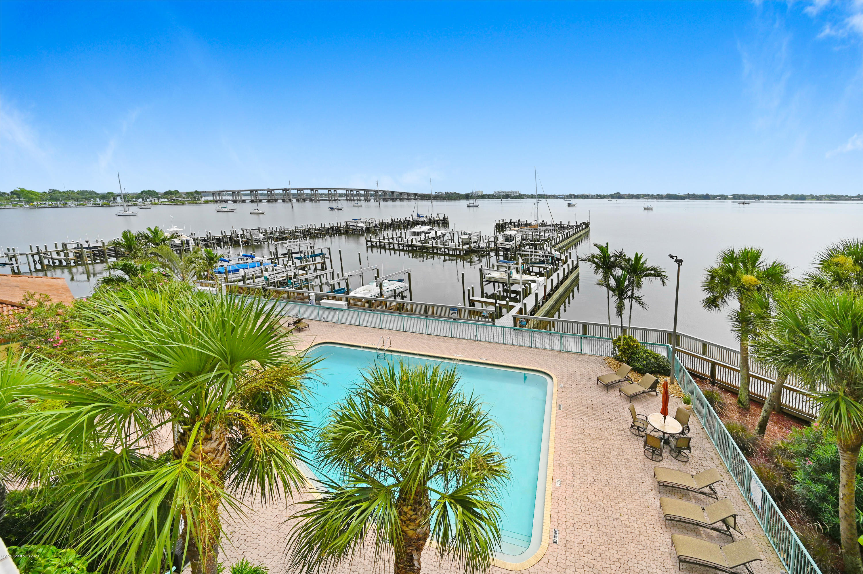 102 Riverside Drive, Unit 304 Cocoa, FL 32922 - Photo 4 of 49 a view of a swimming pool and an ocean view
