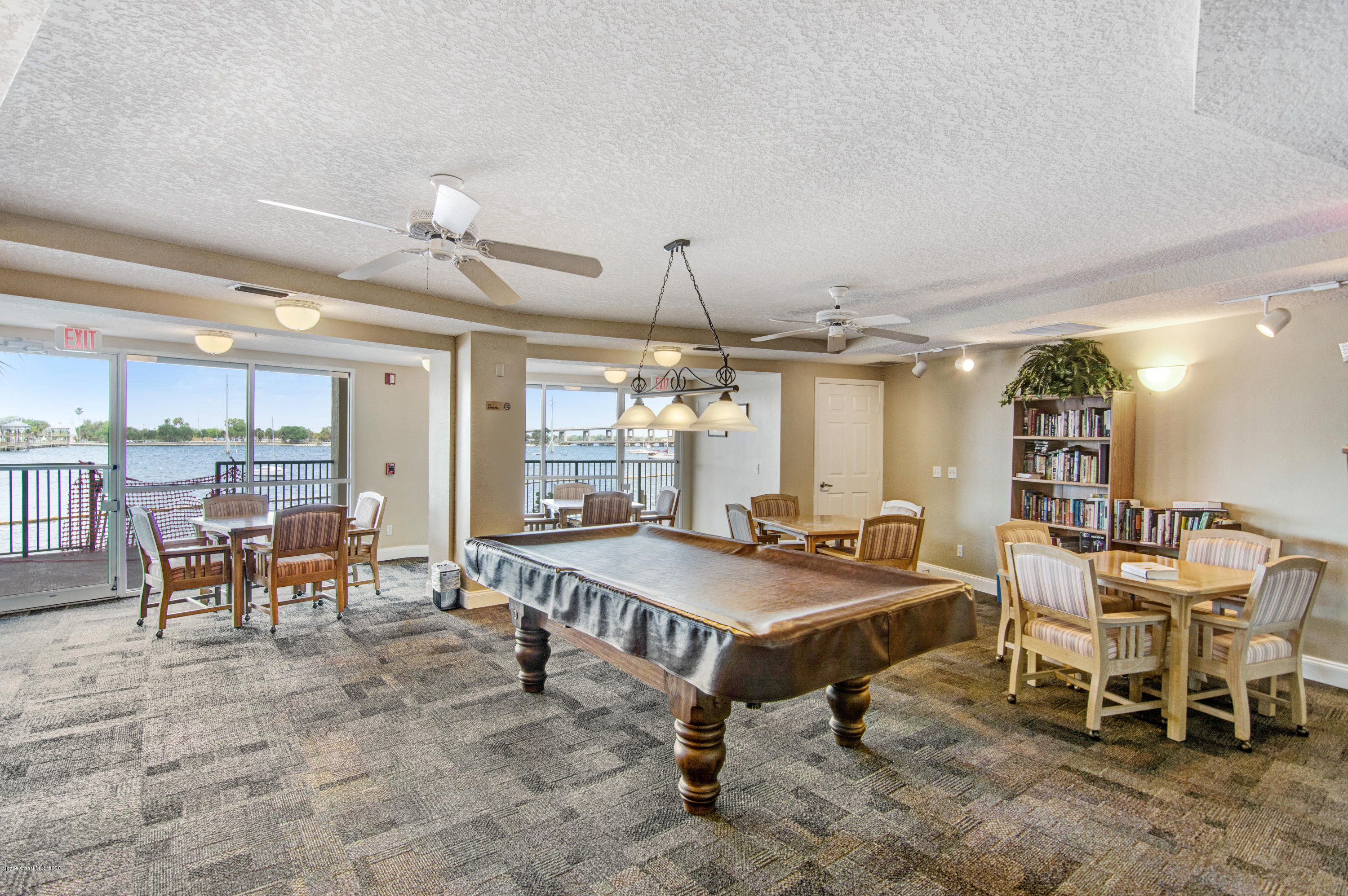 102 Riverside Drive, Unit 304 Cocoa, FL 32922 - Photo 32 of 49 a view of a dining room with furniture