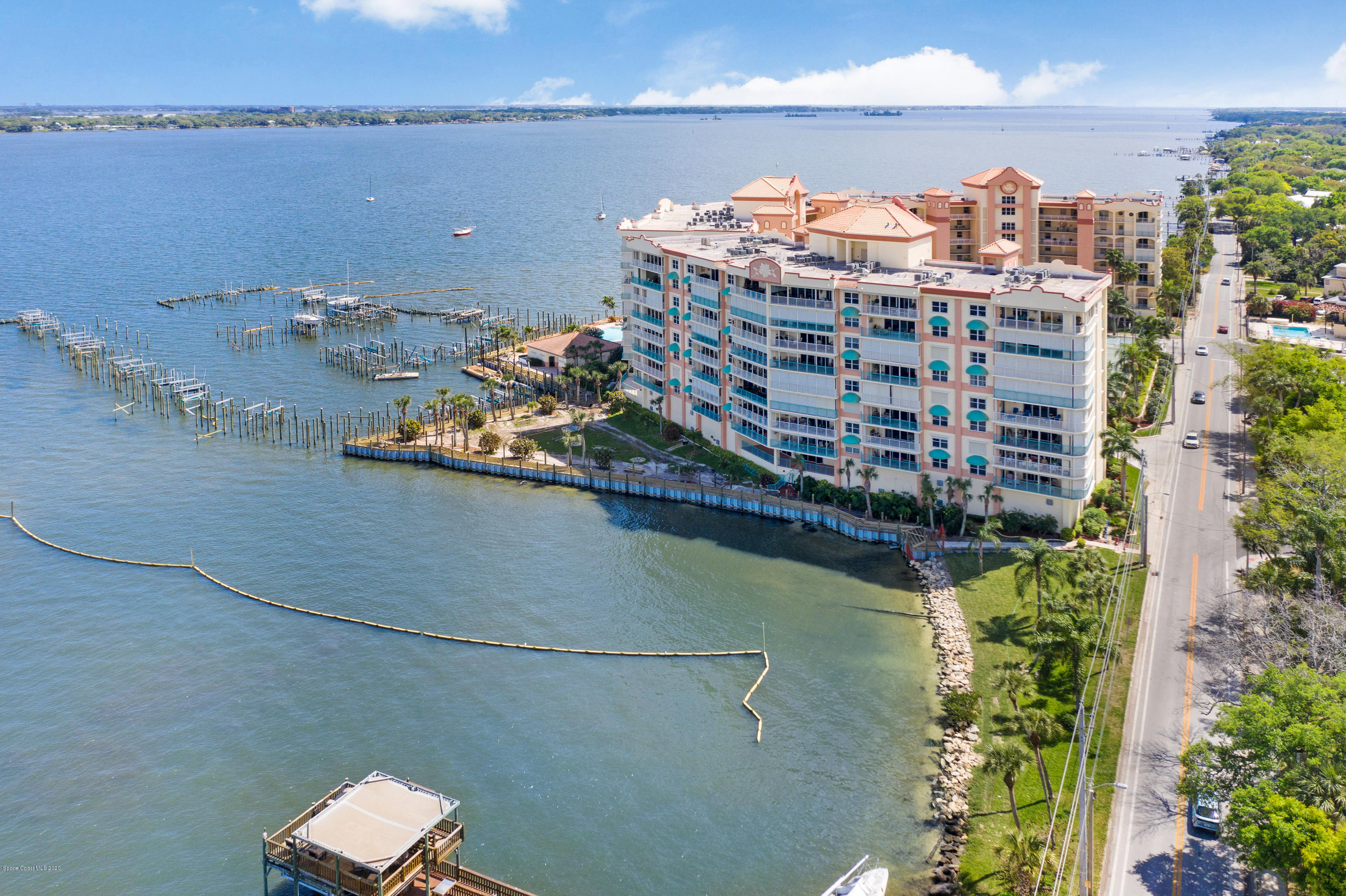 102 Riverside Drive, Unit 304 Cocoa, FL 32922 - Photo 40 of 49 a view of a lake with a building in the background