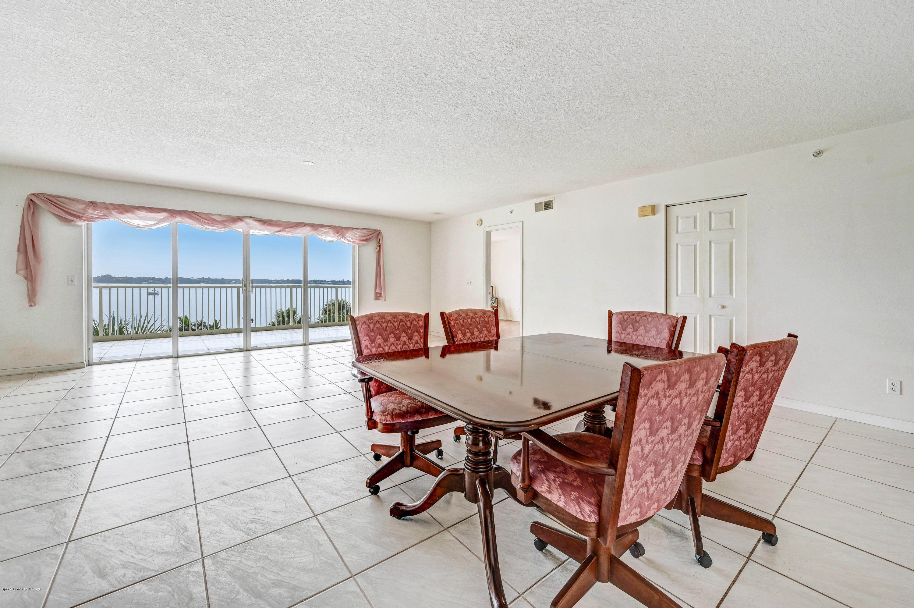 102 Riverside Drive, Unit 304 Cocoa, FL 32922 - Photo 5 of 49 a view of a dining room with furniture
