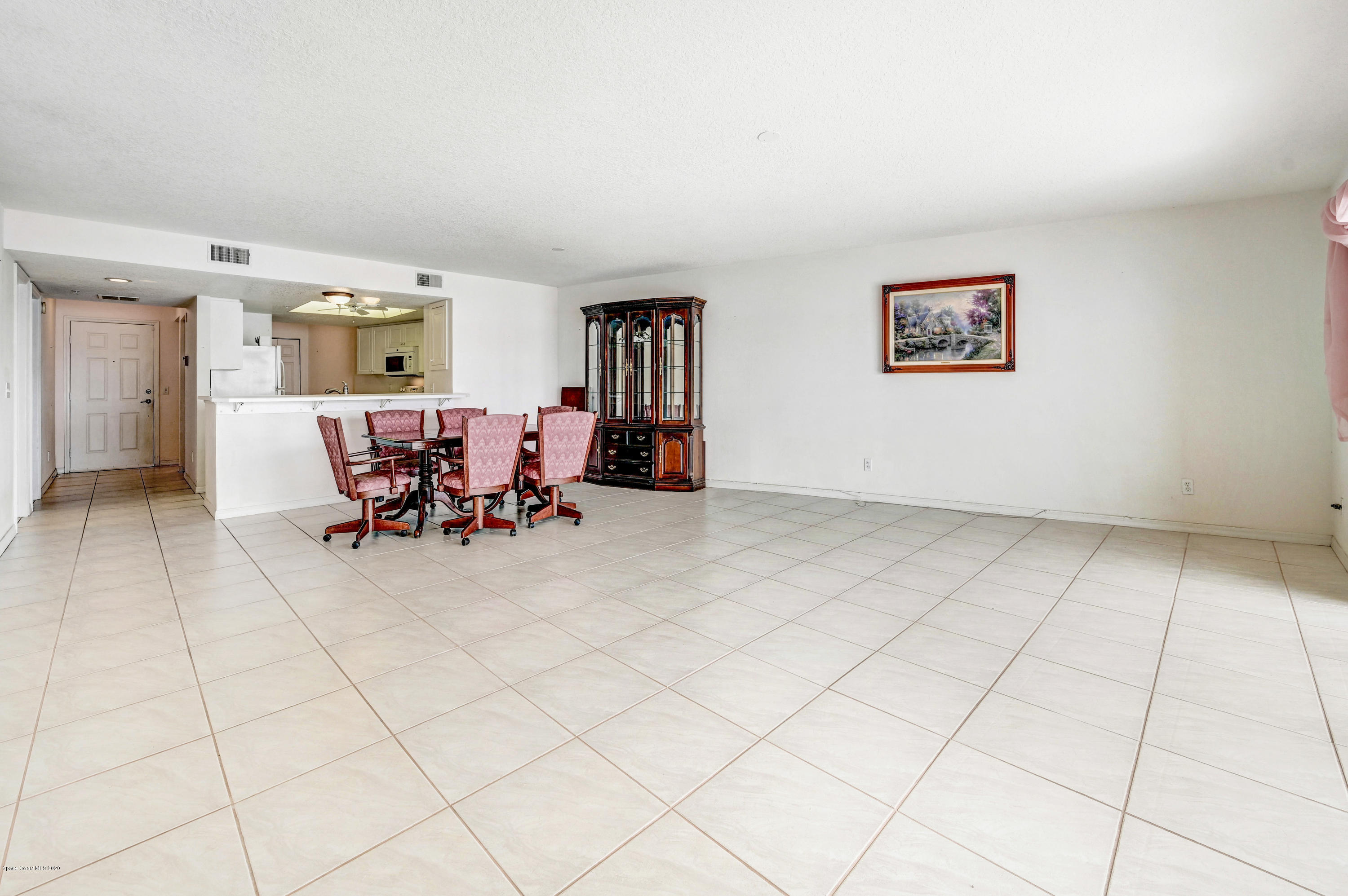 102 Riverside Drive, Unit 304 Cocoa, FL 32922 - Photo 7 of 49 a view of dining room and livingroom with furniture