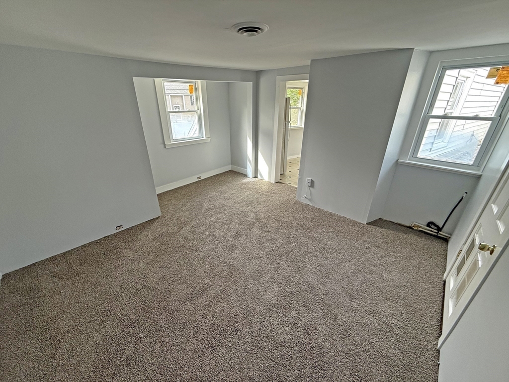 135-137 Temple Street Whitman, MA 02382 - Photo 13 of 15 an empty room with windows