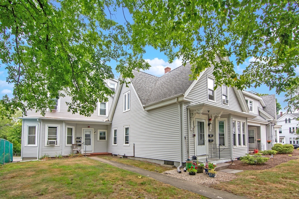 135-137 Temple Street Whitman, MA 02382 - Photo 2 of 15 a view of a yard in front of a house