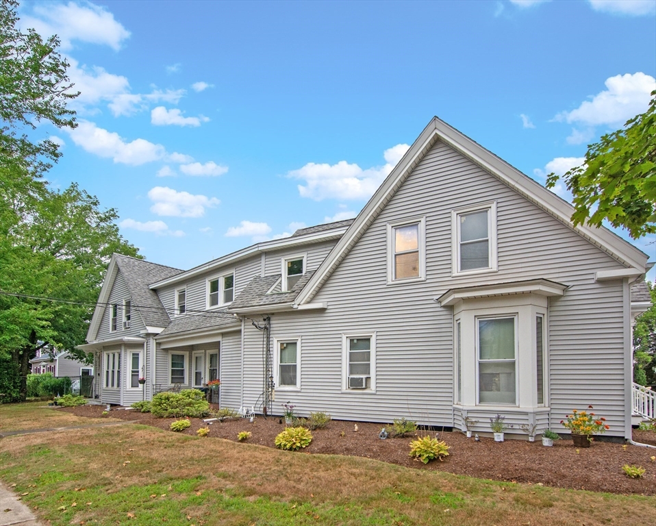 135-137 Temple Street Whitman, MA 02382 - Photo 3 of 15 a front view of a house with garden