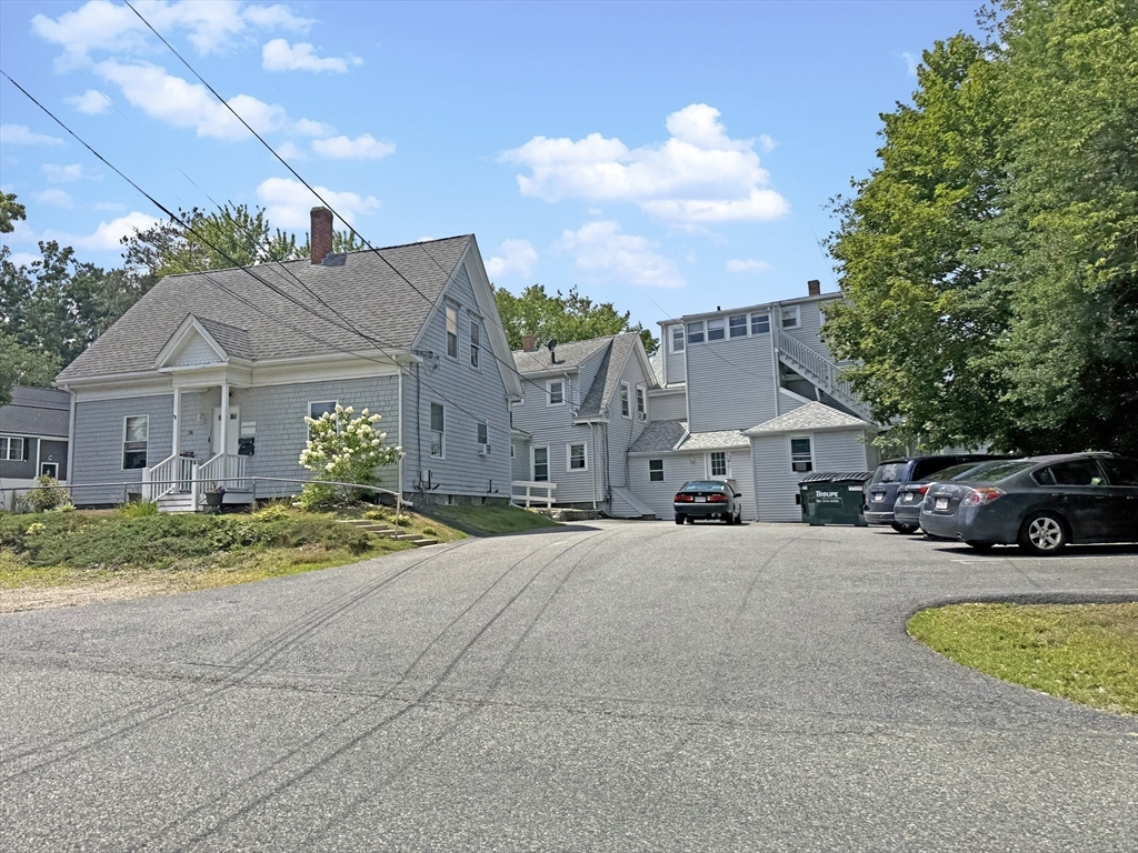 135-137 Temple Street Whitman, MA 02382 - Photo 5 of 15 a view of a house with a patio