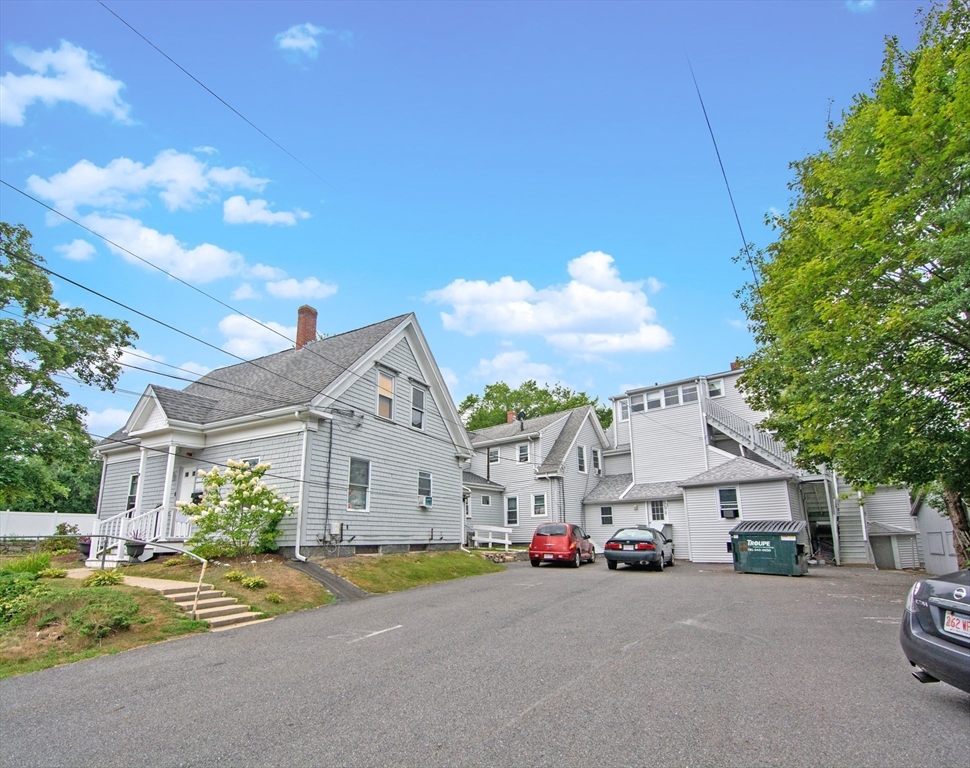 135-137 Temple Street Whitman, MA 02382 - Photo 6 of 15 a view of a street with a building in the background