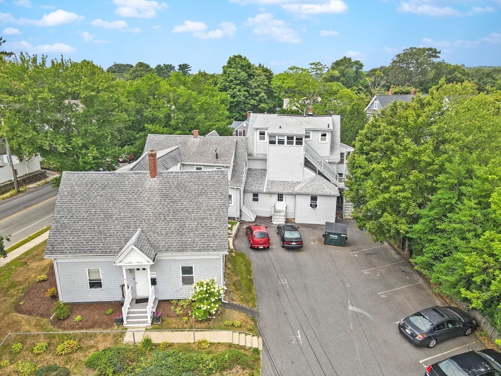 135-137 Temple Street Whitman, MA 02382 - Photo 7 of 15 an aerial view of residential houses with outdoor space and trees