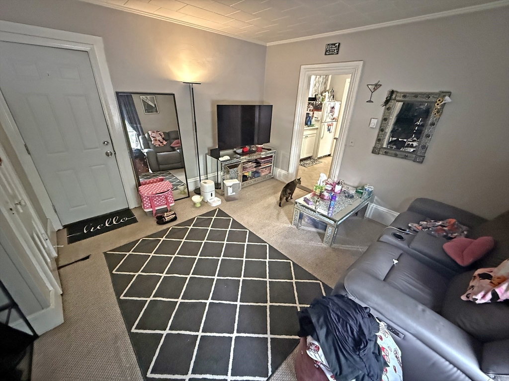 135-137 Temple Street Whitman, MA 02382 - Photo 9 of 15 a room with gym equipment and a flat screen tv