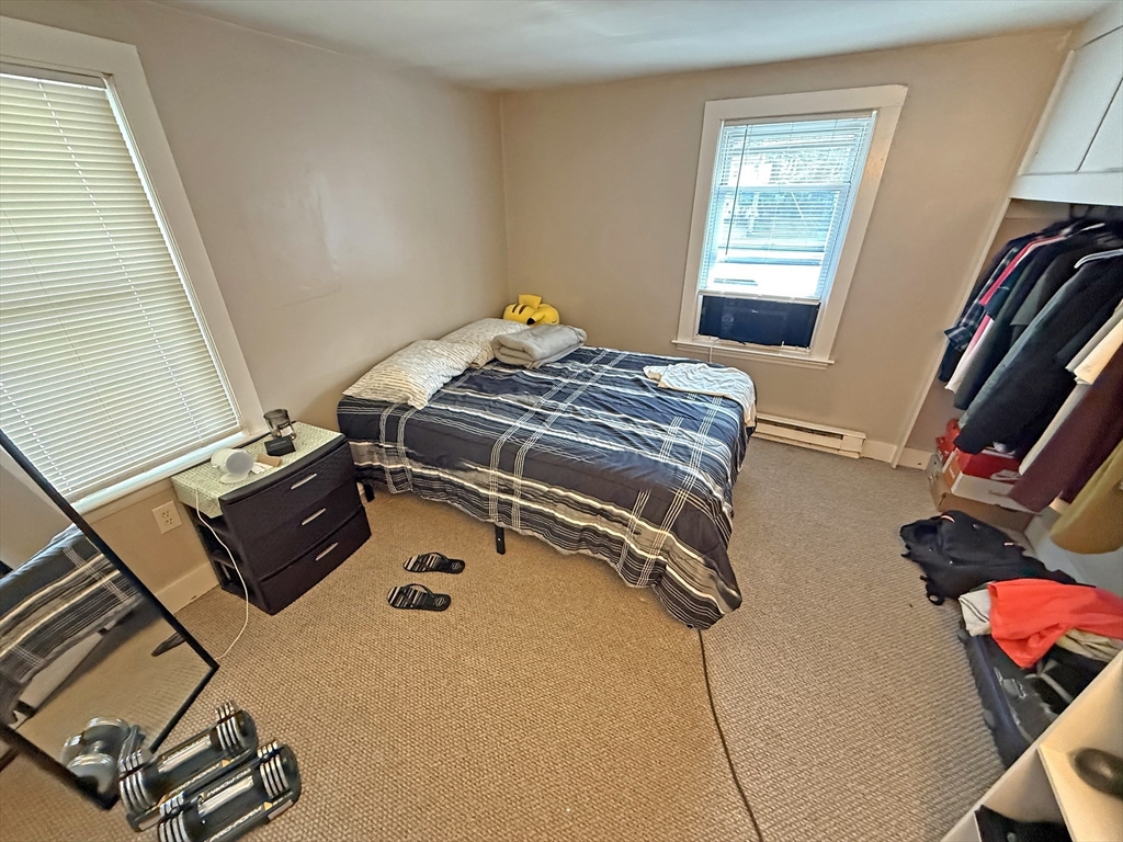 135-137 Temple Street Whitman, MA 02382 - Photo 10 of 15 a bedroom with a bed and a window