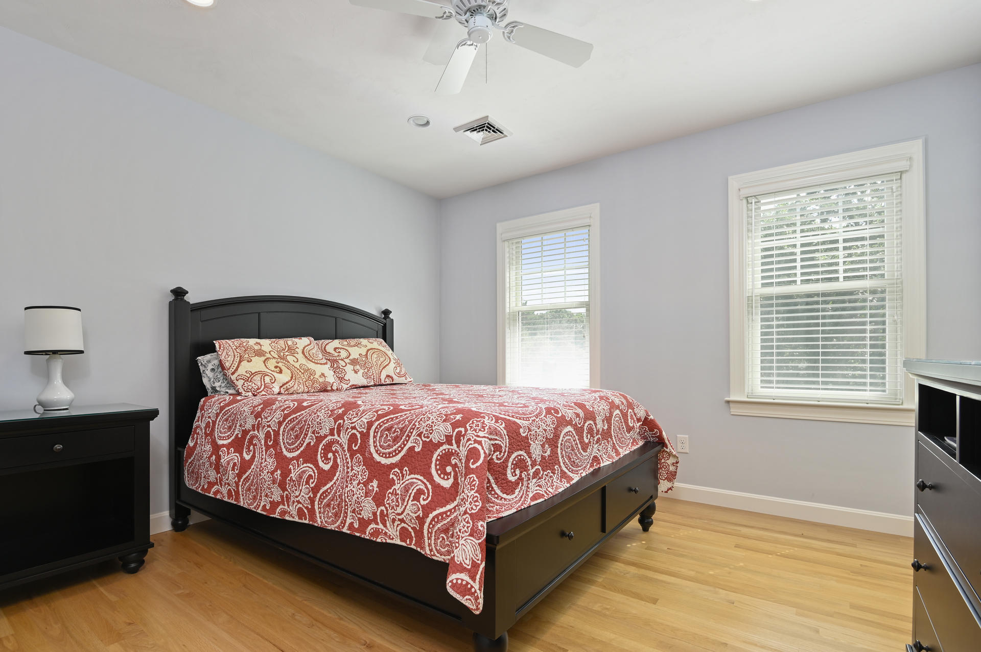 24 Pasture Road Cataumet, MA 02534 - Photo 14 of 24 a large bed sitting in a bedroom next to a window and a chandelier