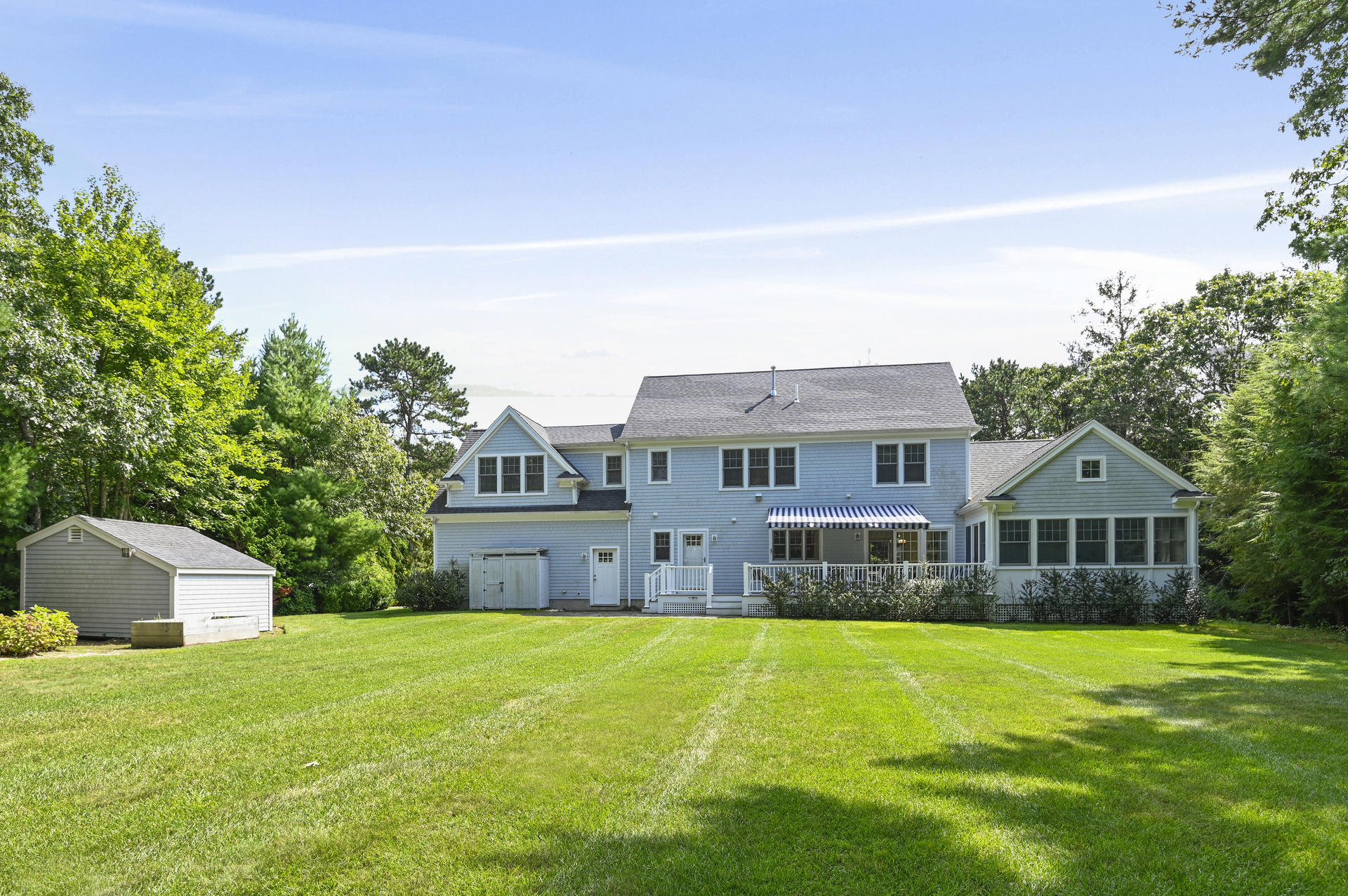 24 Pasture Road Cataumet, MA 02534 - Photo 20 of 24 a front view of a house with a garden