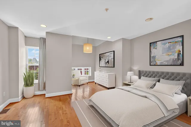 a bathroom with a granite countertop sink a mirror and a shower