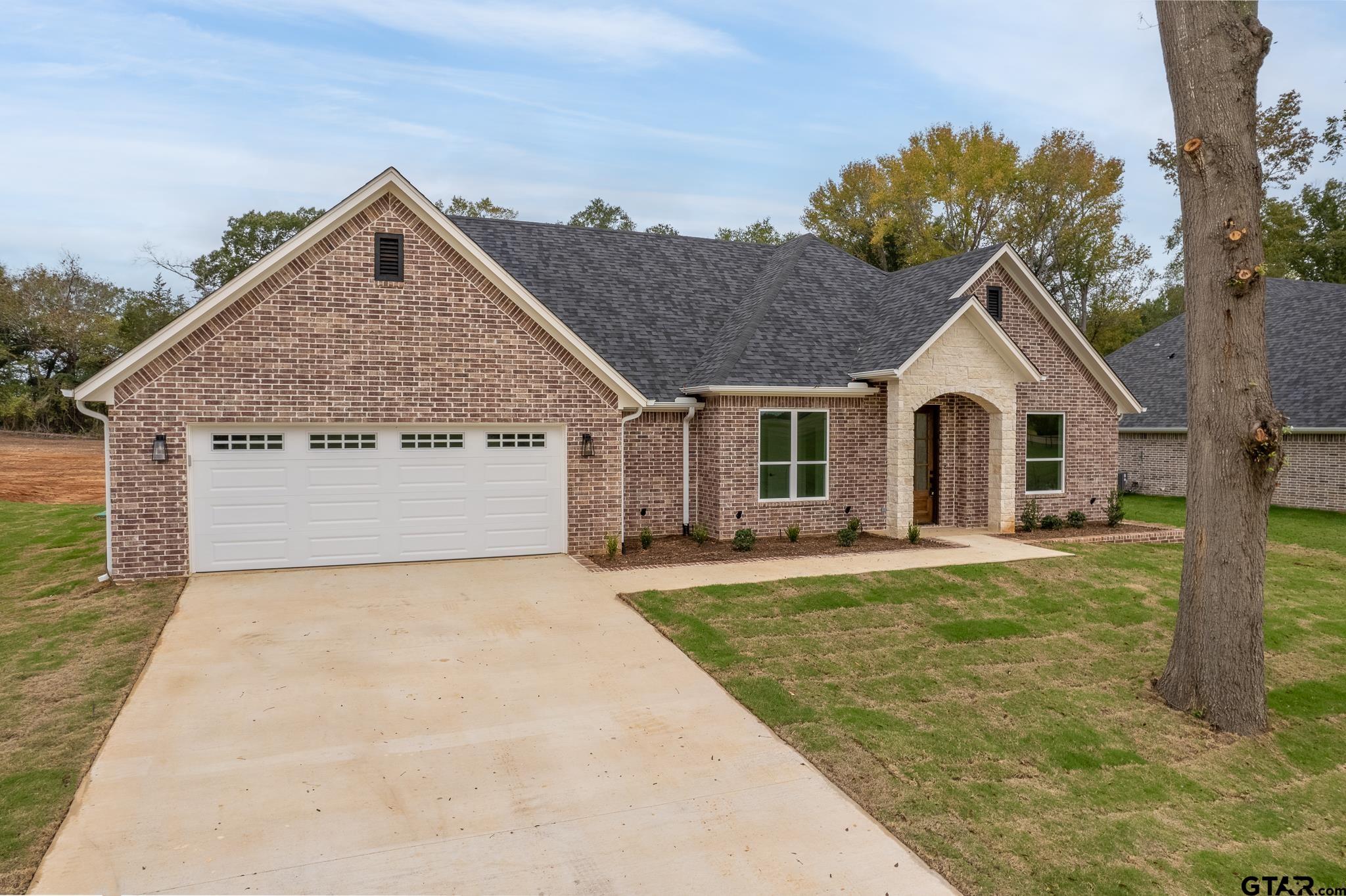 a front view of a house with yard