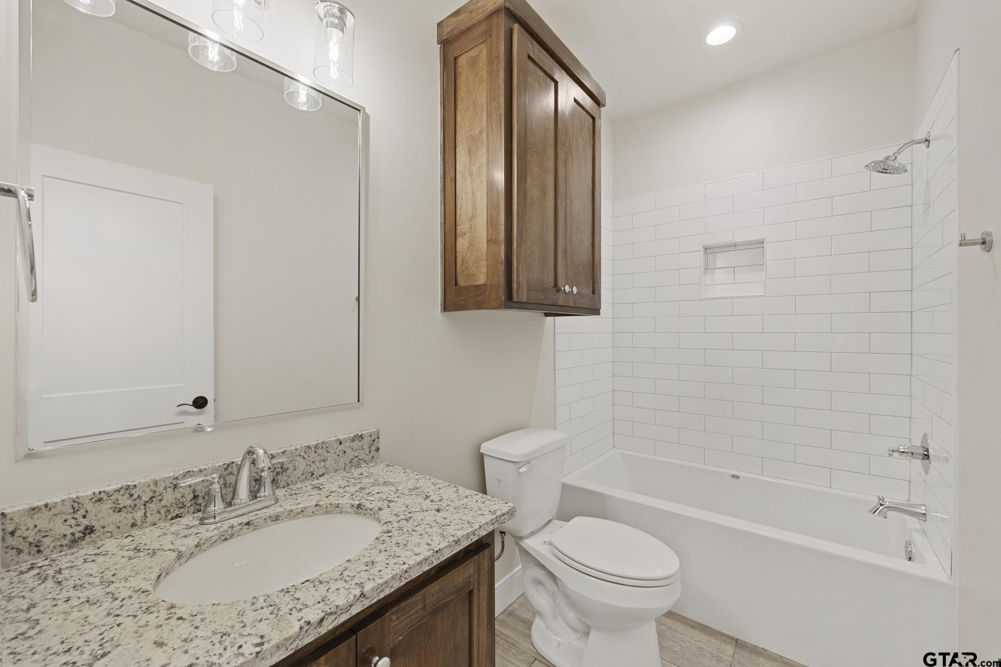 18778-c R 1100 C R 1100 Flint, TX 75762 - Photo 17 of 43 a bathroom with a granite countertop sink toilet and shower