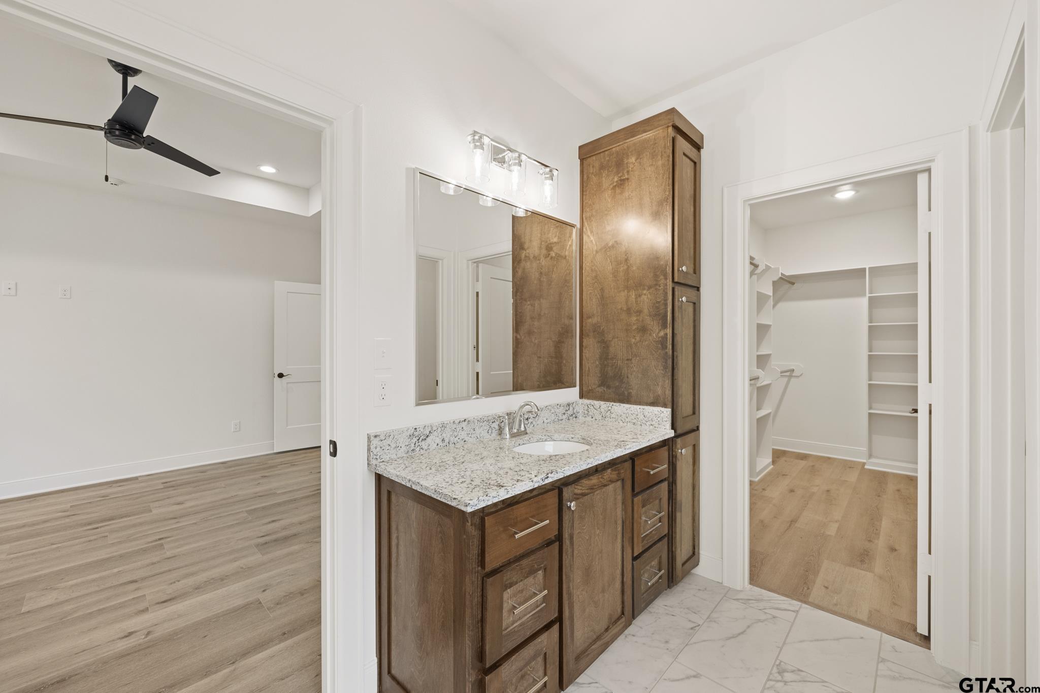 18778-c R 1100 C R 1100 Flint, TX 75762 - Photo 25 of 43 a bathroom with a granite countertop sink and a mirror