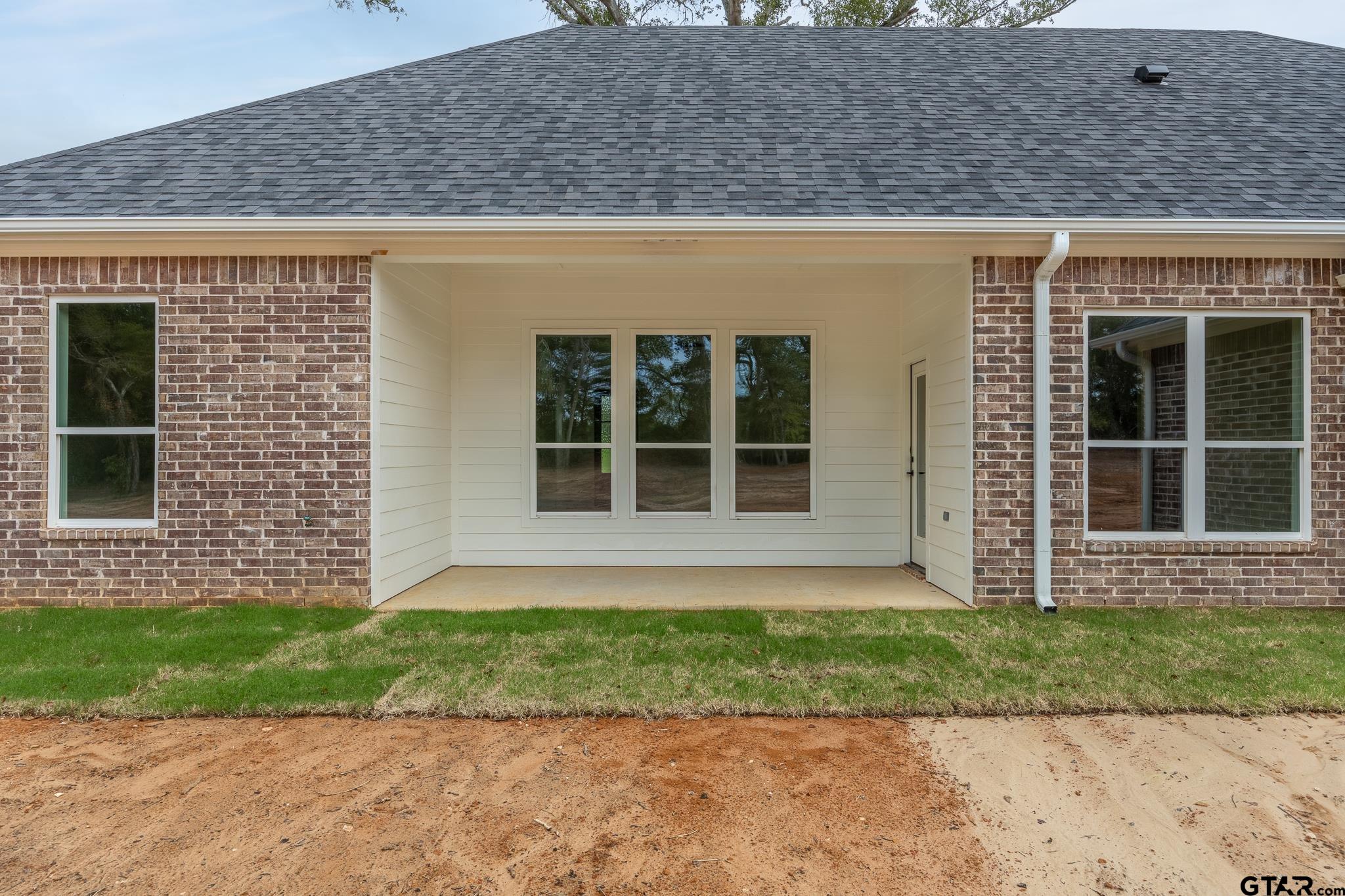 18778-c R 1100 C R 1100 Flint, TX 75762 - Photo 31 of 43 a front view of a house with a garden and yard
