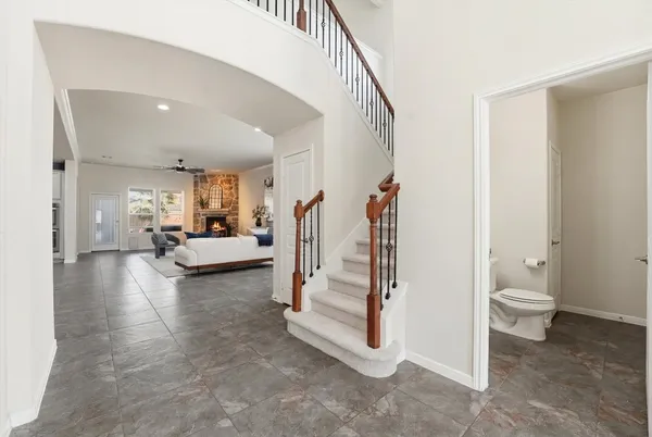 a kitchen with stainless steel appliances granite countertop a sink stove and cabinets