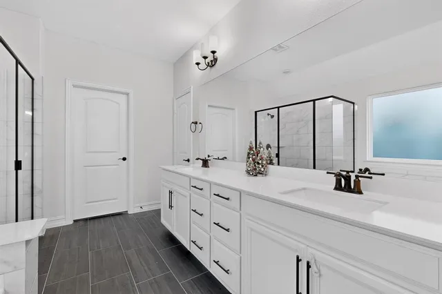 a bathroom with a bathtub and a shower